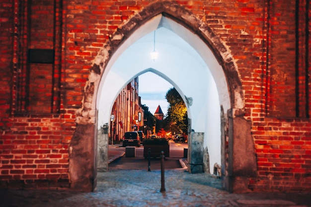 A brick wall with a sign that says'the city of riga '