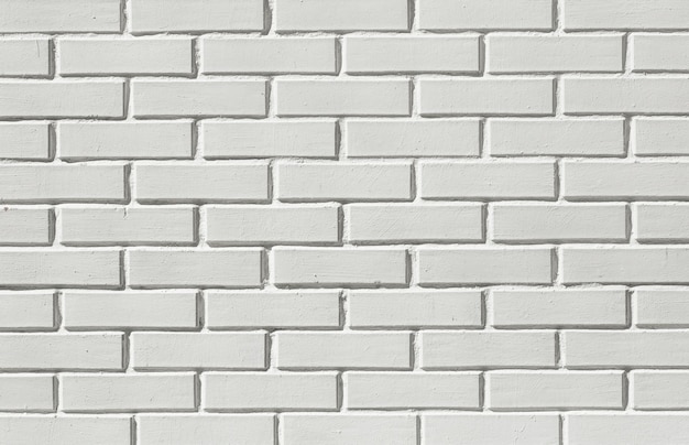 レンガの白い壁の背景。白い石のレンガ。高品質の写真
