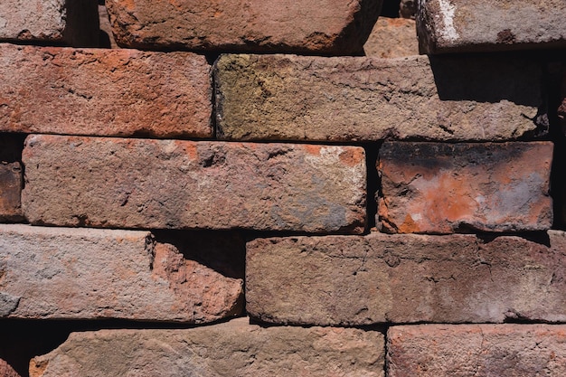 Brickwork texture background of bricks construction material\
red stone lots of red bricks