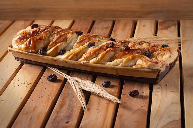 Bricohe bread with raisins and wheat branches