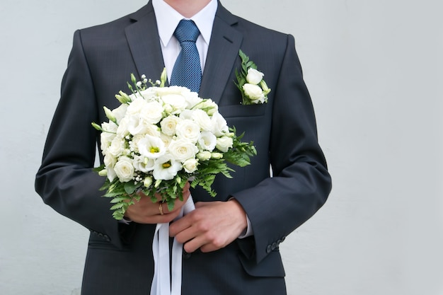 Bridal bouquet in hands of bride