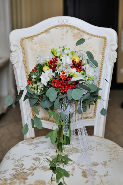 Bridal bouquet lying on the chair