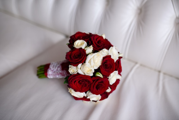 Bridal bouquet of red and white roses.