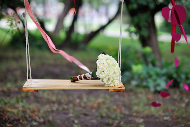 Bridal bouquet on swing