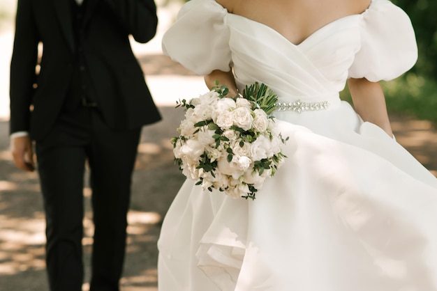 Bridal bouquet of white peonies and roses