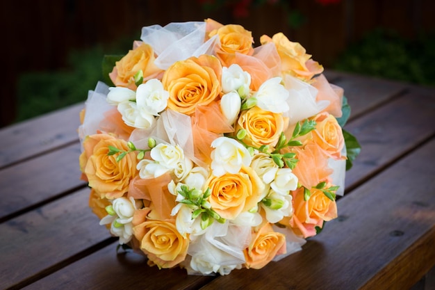 Bridal bouquet with orange and white flowers