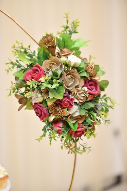 Bridal bouquet with red roses and green leaves Wedding decoration