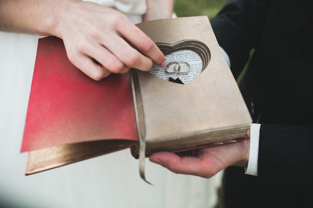 Bridal couple clink glasses of champagne on the nature