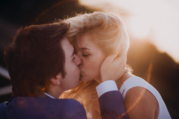 Bridal couple kissing