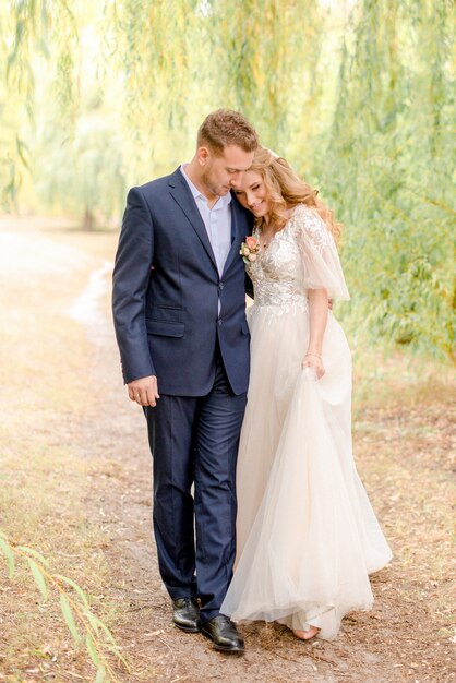 Bride and 6 walking through the park