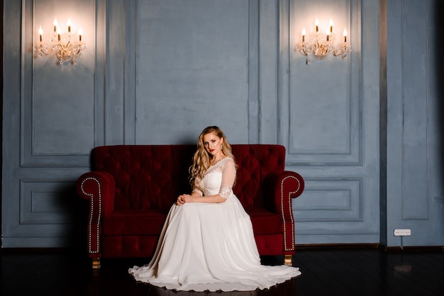 Bride on the background of new year lights, christmas interior