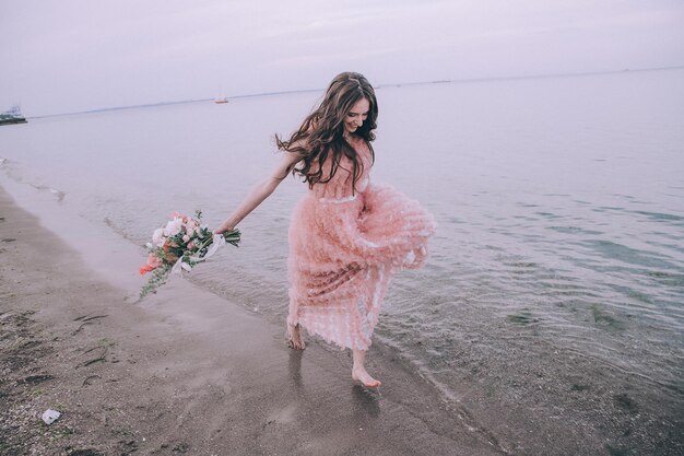 Bride on beach near sea