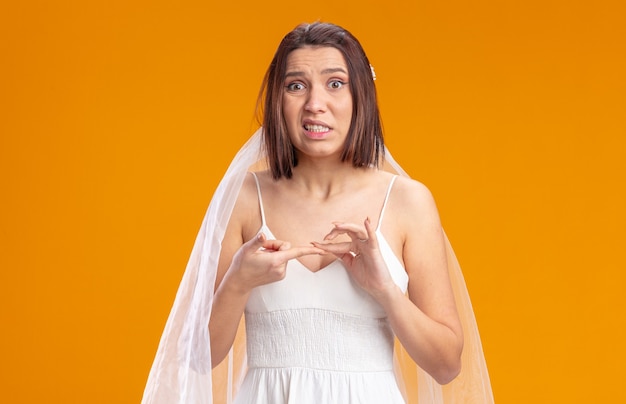 Bride in beautiful wedding dress looking confused and very anxious