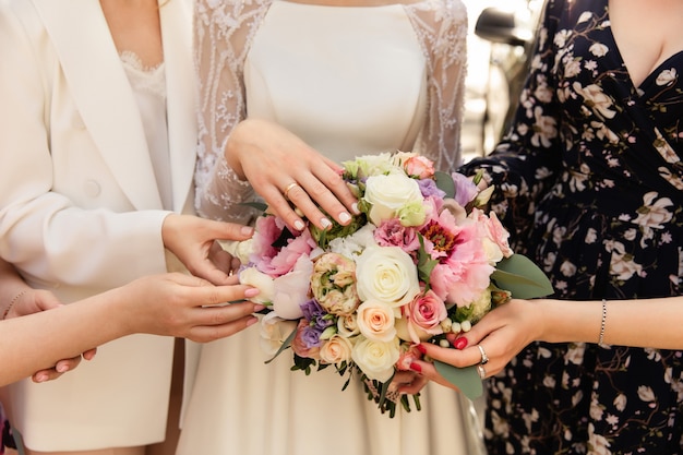 Bride, bridesmaids and wedding bouquet