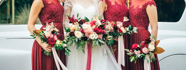 Bride and bridesmaids with wedding bouquets