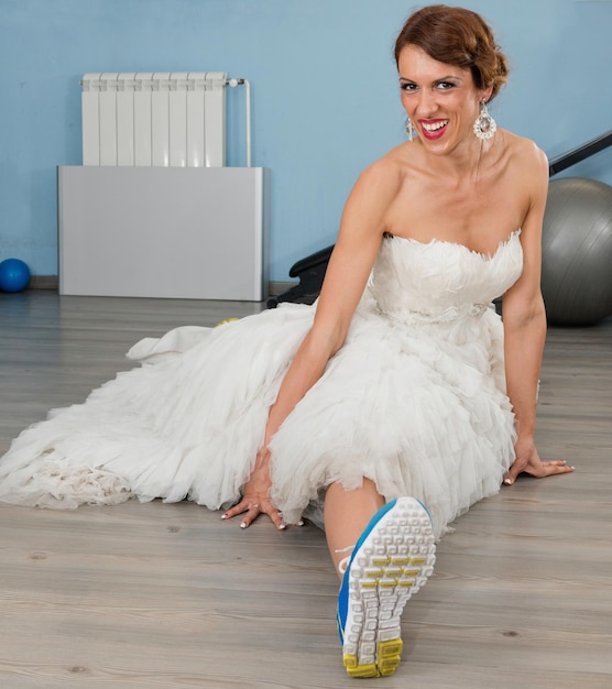 Bride doing split stretching