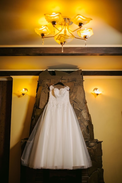 bride dress on wall background, in hotel