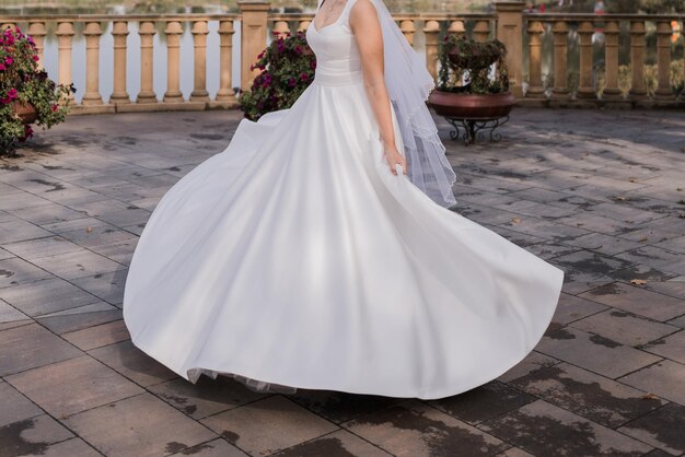 The bride on the embankment in a wedding dress