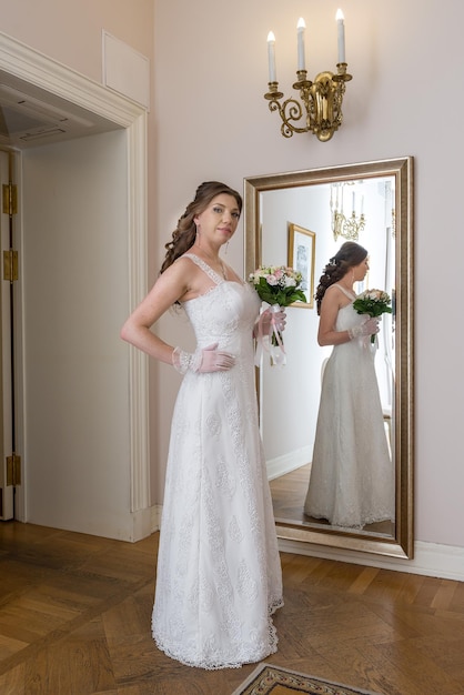 The bride in front of the mirror