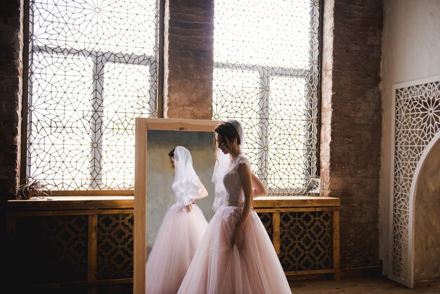 The bride gathers in the morning near the mirror