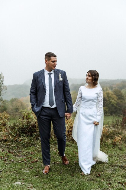 Bride and groom in autumn outdoors