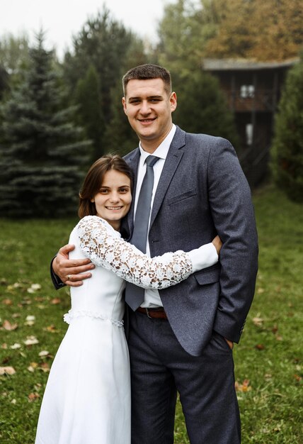 Bride and groom in autumn outdoors