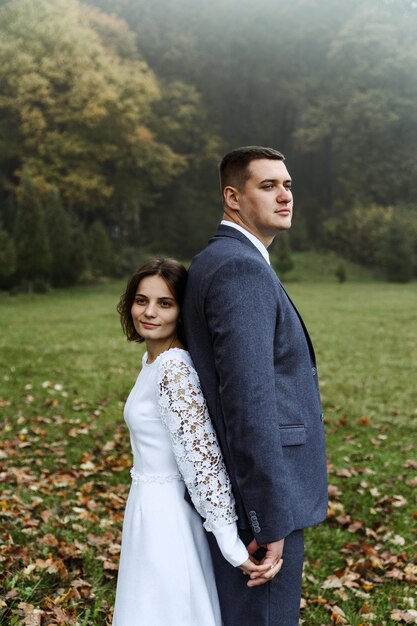 Bride and groom in autumn