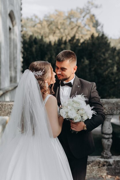 bride and groom on the background of fairy fog in the forest.