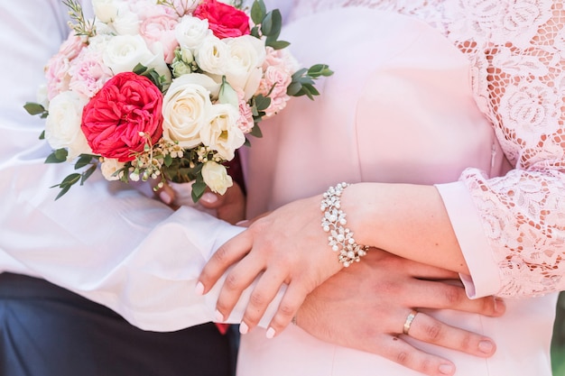 Bride and groom. Bride holds a bouquet in her hands