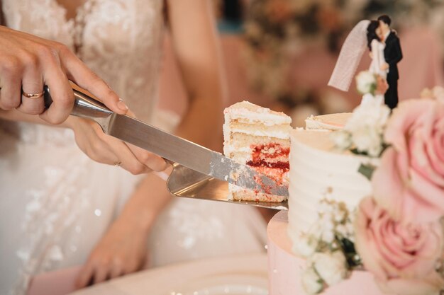 Bride and groom cut a piece of cake