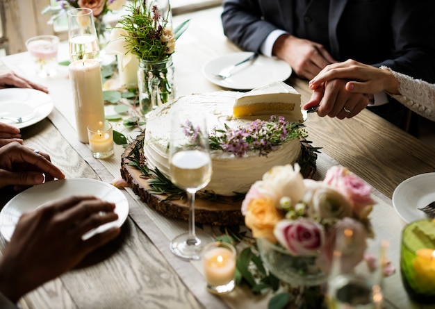 Bride and Groom Cutting Cake on Wedding Reception