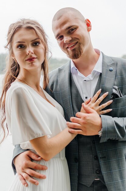 the bride and groom embrace