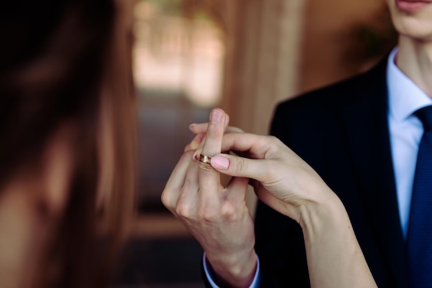 Bride and groom exchange rings at the wedding