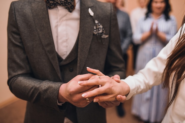 The bride and groom exchange rings