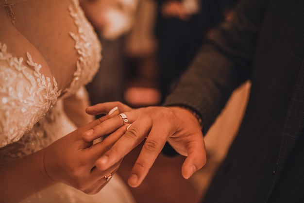 The bride and groom exchange rings