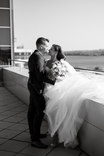 Bride and groom first meeting on the roof of skyscraper