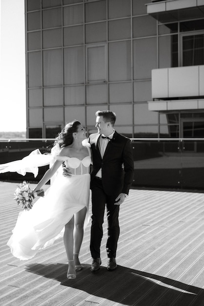 Bride and groom first meeting on the roof of skyscraper