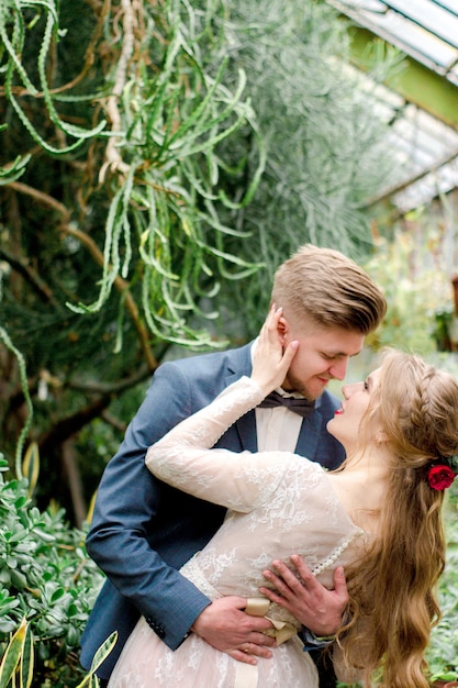 Bride and groom in greenhouse