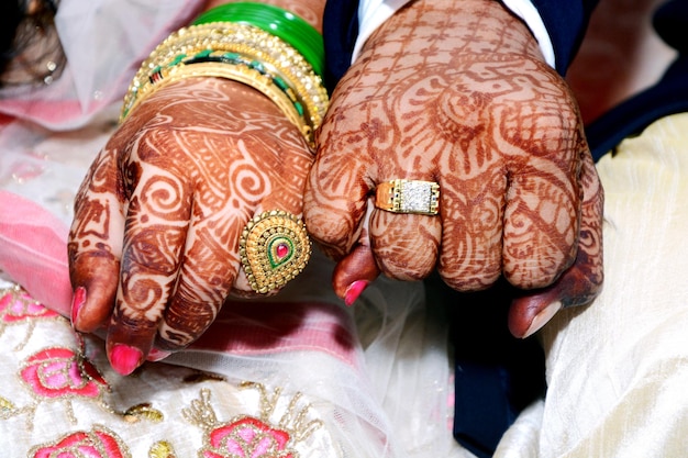 The bride and groom hands holding & showing wedding Jewelry Rings