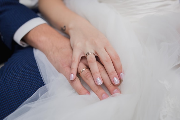 A bride and groom hold hands together