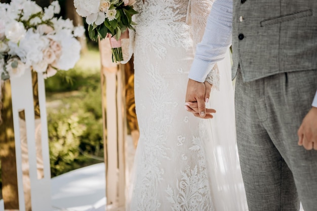 Bride and groom holding hands outdoors wedding theme