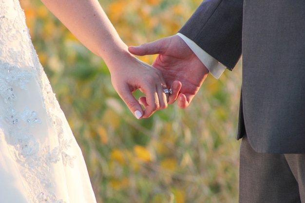 Bride and groom holding hands