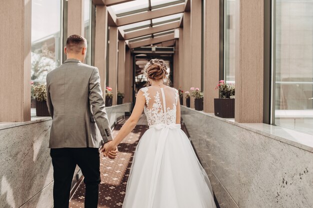 Bride and groom holding hands