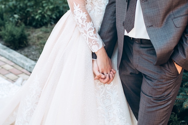 Bride and groom holding hands