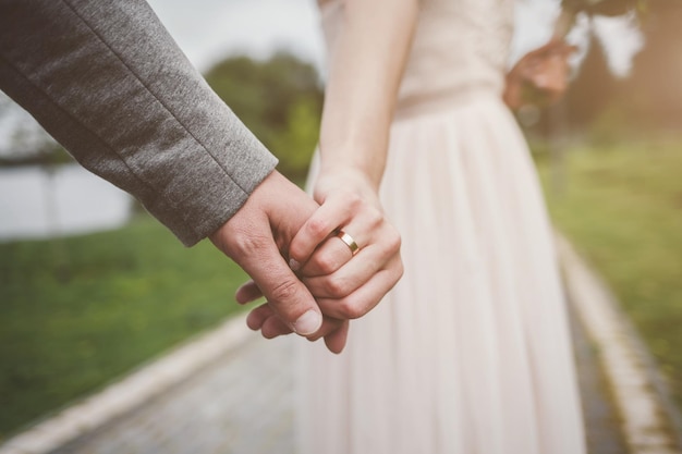 Bride and groom holding hands