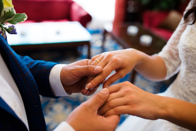 Bride and groom holding hands.