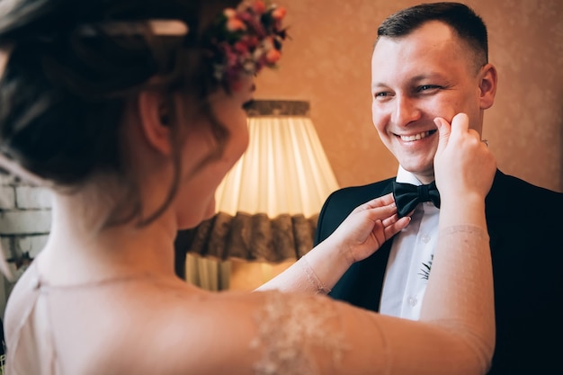 Bride and groom hugging on wedding day