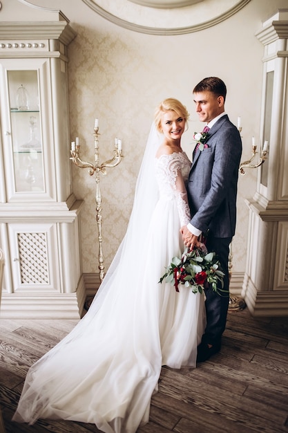 Bride and groom hugging on wedding day