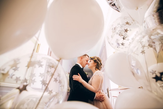 Bride and groom hugging on wedding day