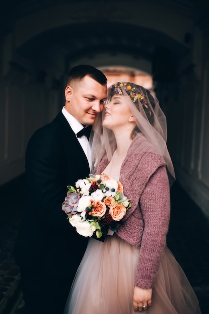 Bride and groom hugging on wedding day